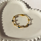 Evil Eye Bead Accent Bangle Bracelet – Gold Toned & Tarnish Resistant