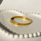 Screw & Crystal Accent Bangle Bracelet – Gold Toned & Tarnish Resistant