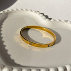 Screw & Crystal Accent Bangle Bracelet – Gold Toned & Tarnish Resistant