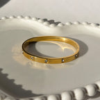 Screw & Crystal Accent Bangle Bracelet – Gold Toned & Tarnish Resistant