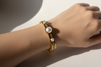 Gold bangle with big pearls and zircons