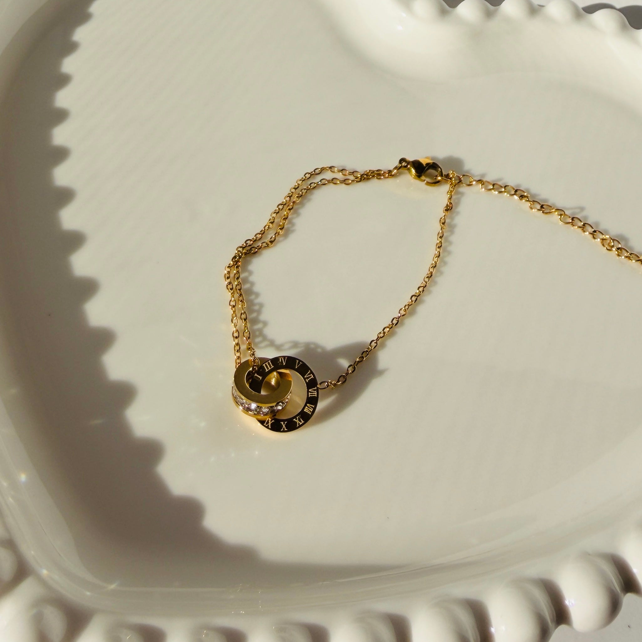 Interlocking Roman Numeral Ring & Crystal Accent Bracelet – Gold Toned & Tarnish Resistant