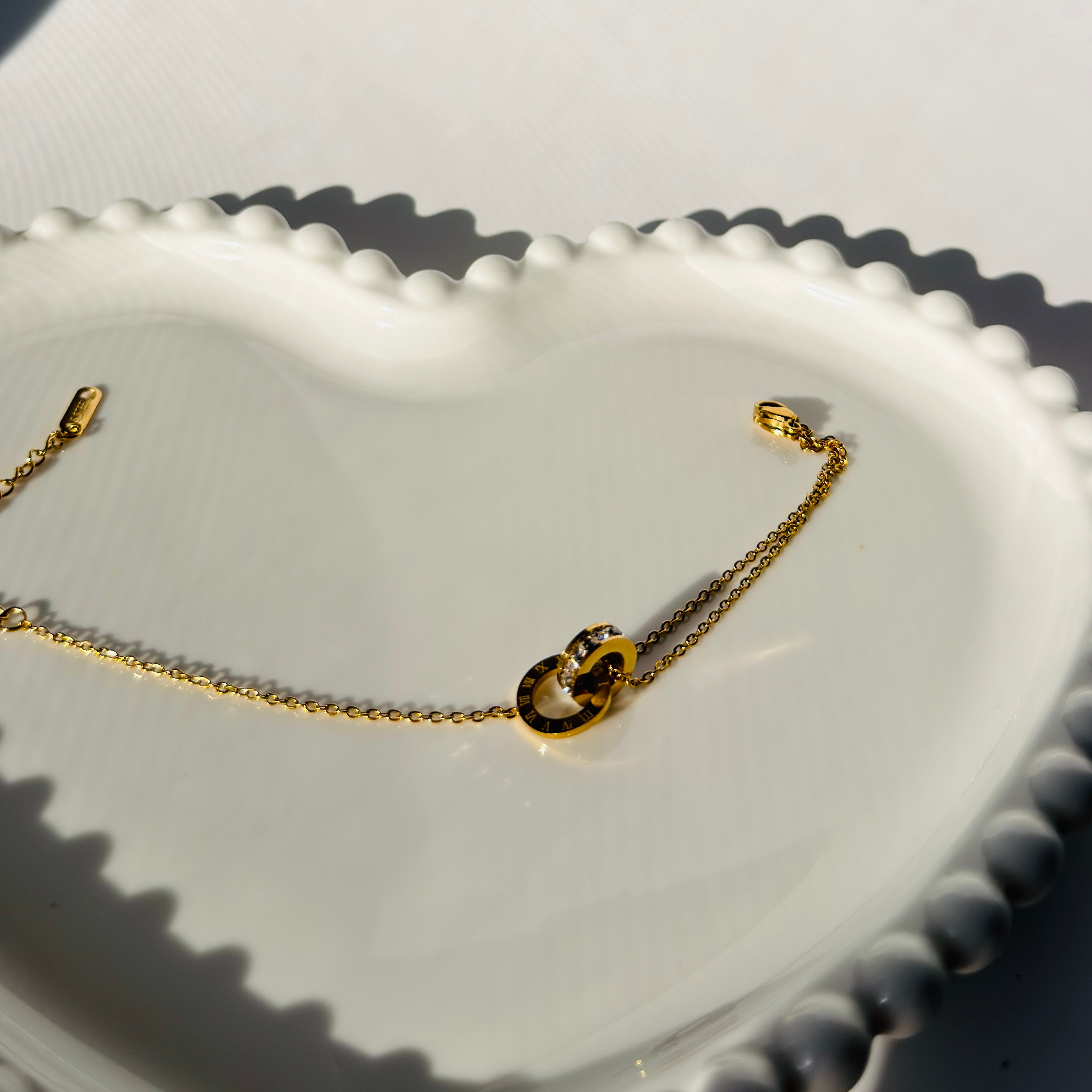 Interlocking Roman Numeral Ring & Crystal Accent Bracelet – Gold Toned & Tarnish Resistant