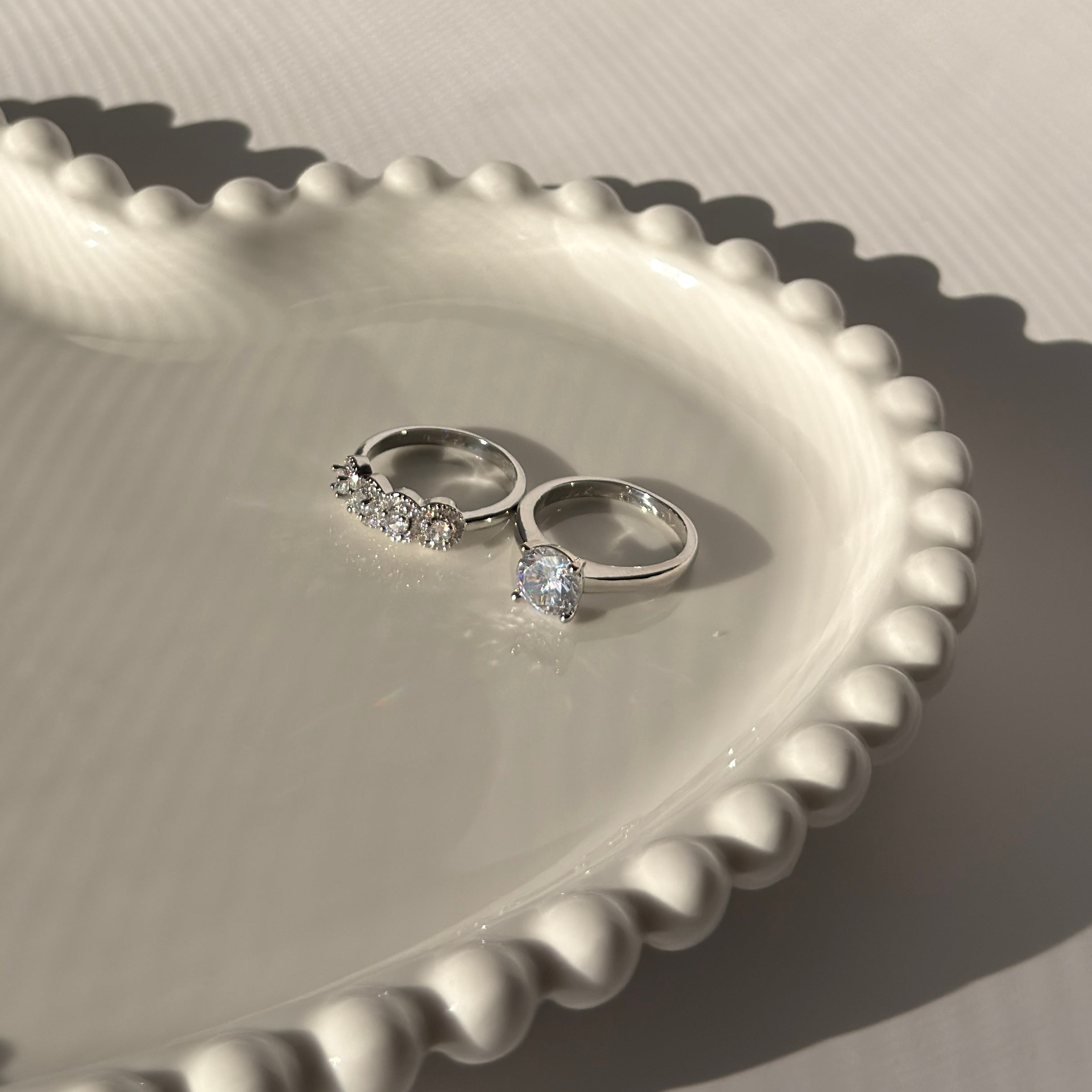 Double ring with silver plating and zircons