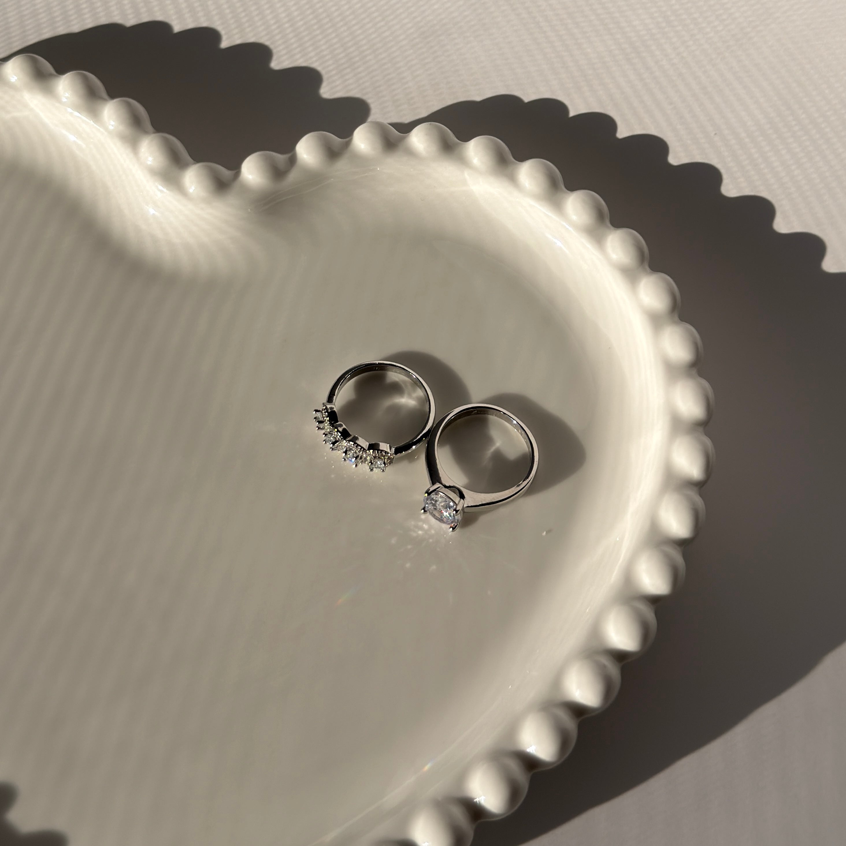 Double ring with silver plating and zircons