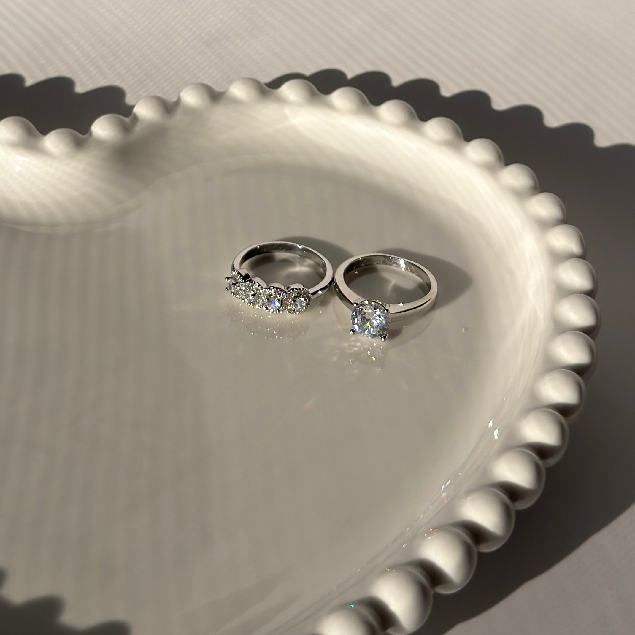 Double ring with silver plating and zircons